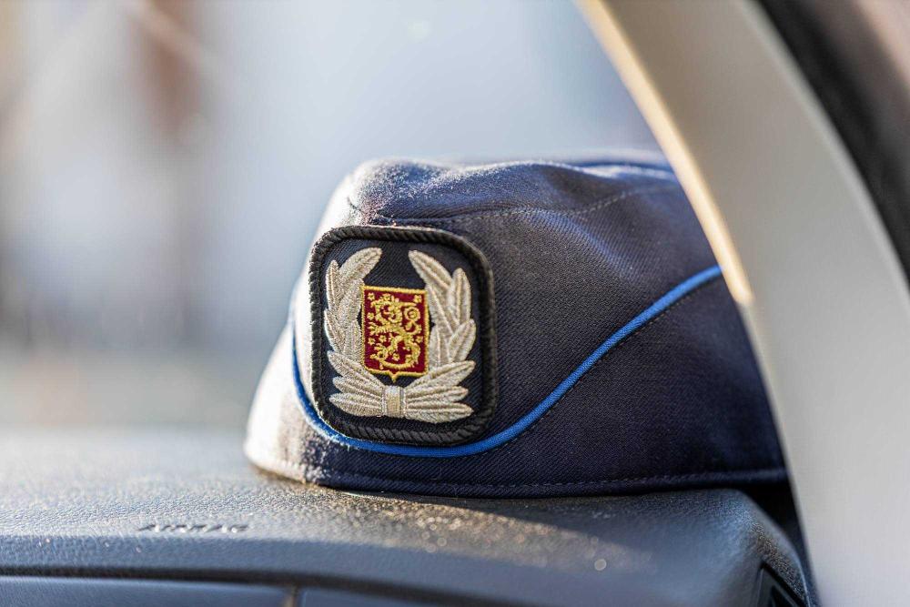 Police headgear on a car window.